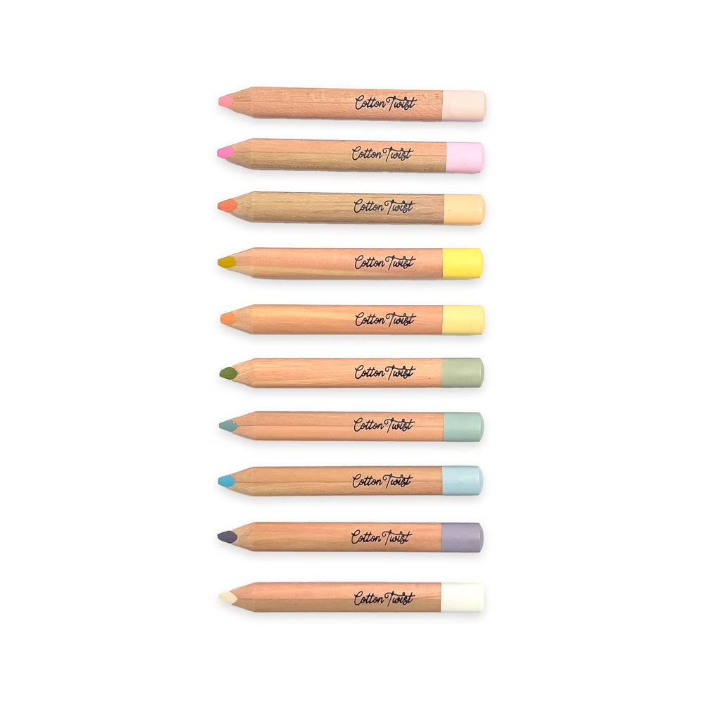 Pastel watercolour pencils lined up showing color range