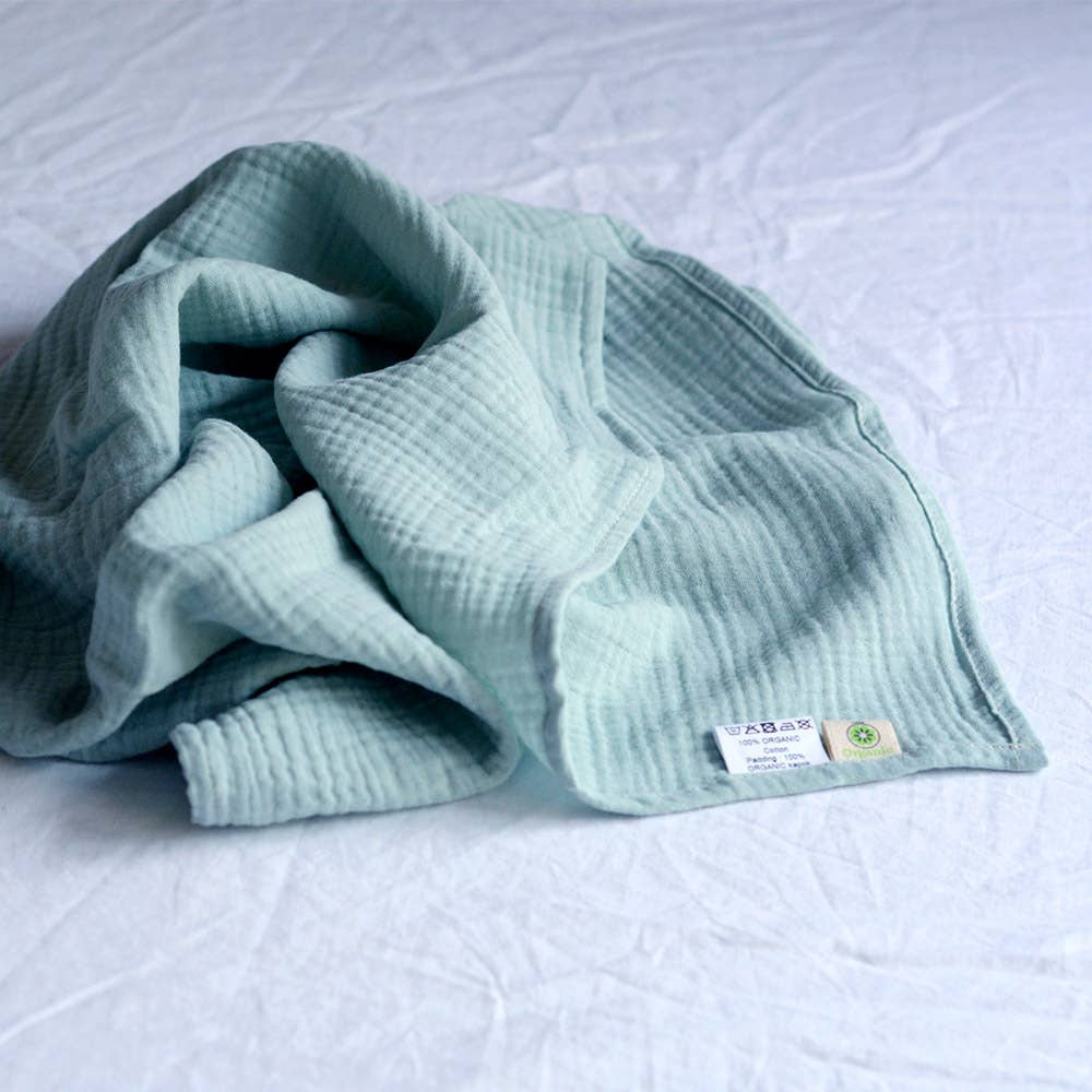 Organic cotton muslin blanket, sage green, folded
