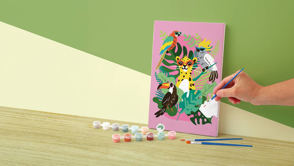 Child painting tropical paint by numbers canvas