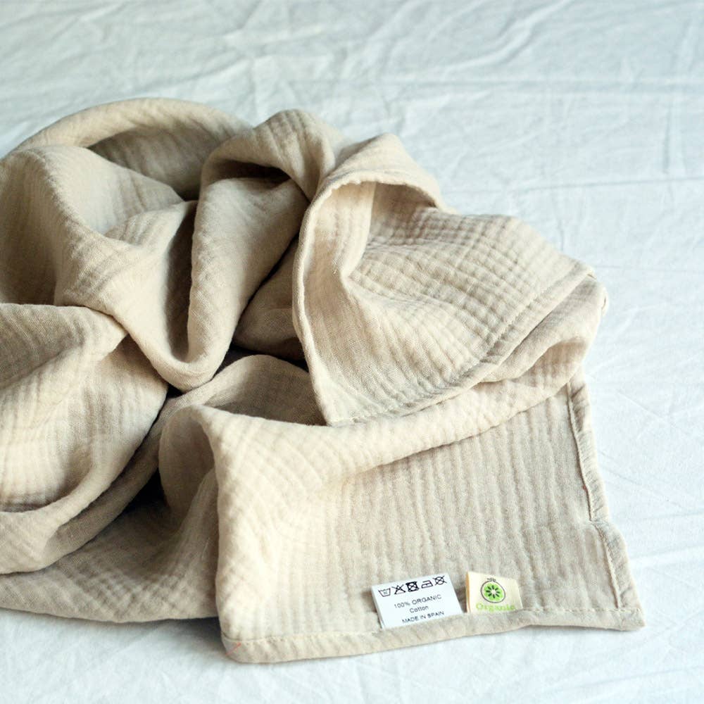 Organic cotton muslin blanket, cream, folded