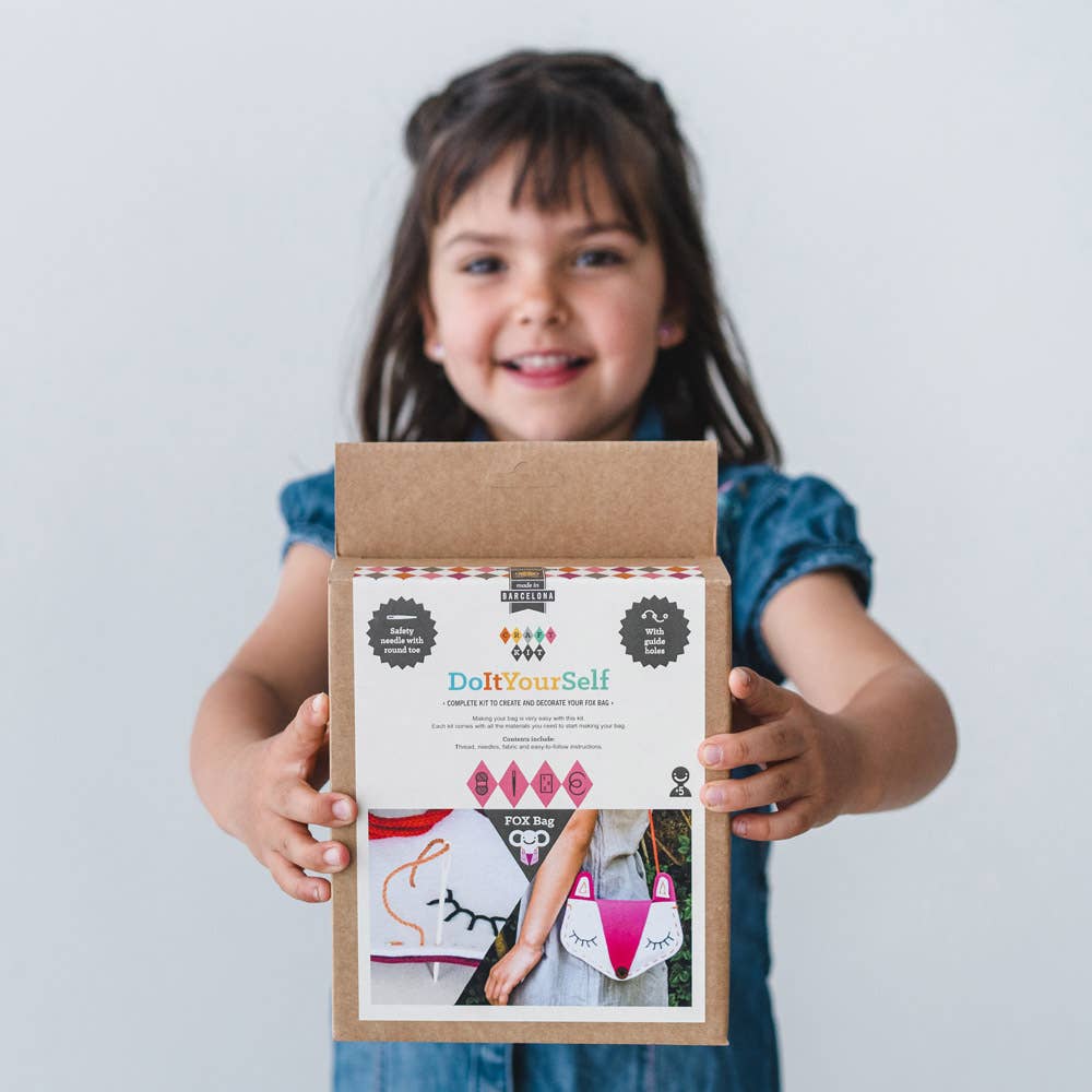 Girl holding Bag Making Kit: Fox box