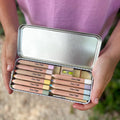 Open tin of pastel mix watercolour pencils