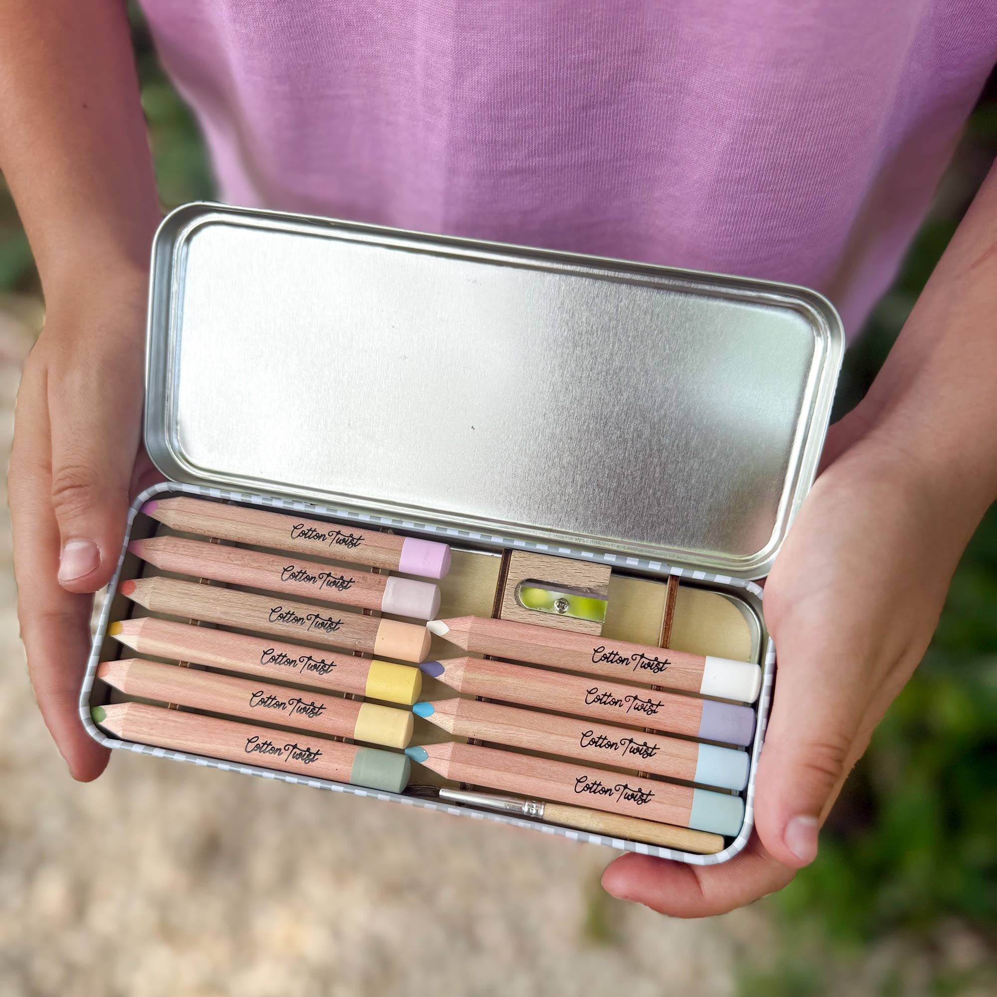 Open tin of pastel mix watercolour pencils