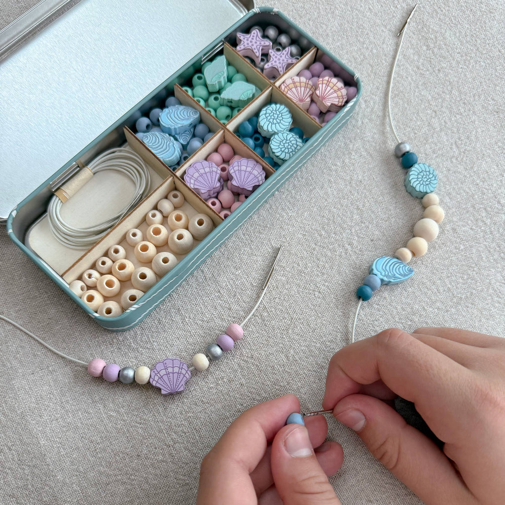 Seashell bracelet kit with wooden beads in tin box