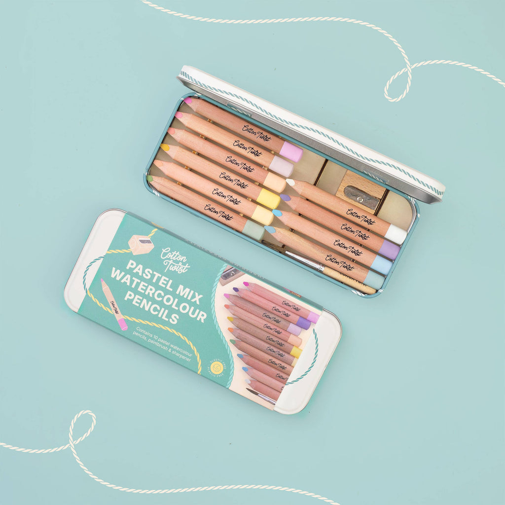 Watercolour pencils set flat lay on teal background