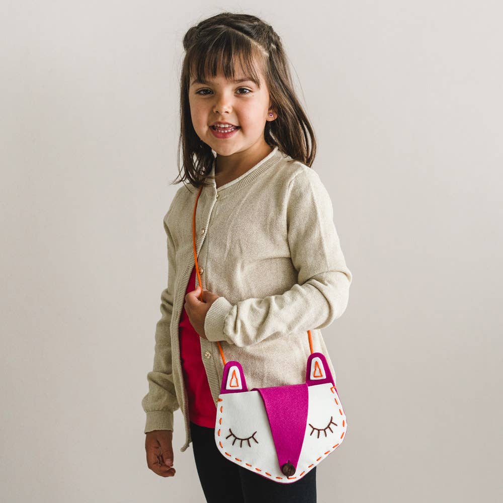 Girl wearing DIY fox bag, front view