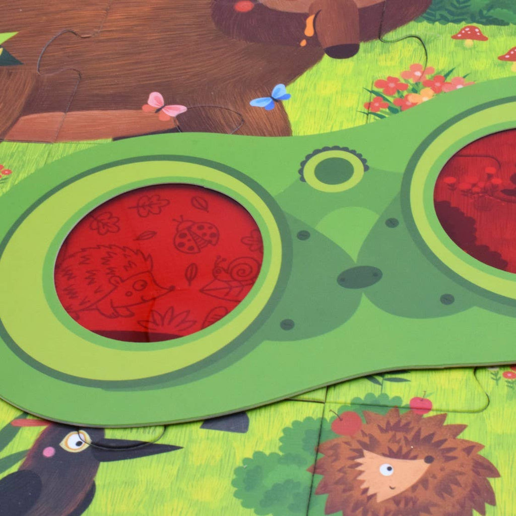 Detective glasses revealing hidden creature on puzzle